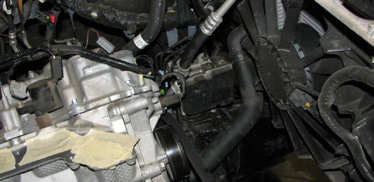 Use a turkey baster, hand pump or siphon to drain the power steering fluid reservoir.