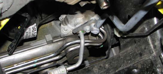 (Customers installing the Supercharger on an Expedition/Navigator only) Remove the bolt that holds the power steering pressure line retention-bracket onto the under side of the pump. 77.