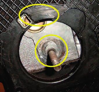 You can see the marks on the engine caused by this type of wrong fitment in Fig. 9. In this case you will also see that the index tab on the tensioner is slightly bent over.