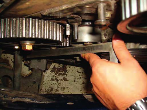 Spring trapped behind tensioner Serious misalignment Fig. 6 B) Engines with a coil spring tensioner (Fig.