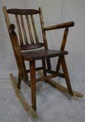 141.001 1 Chair, rocking, arms with cushion 24 33 45 Wood frame