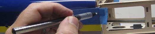 Use a fine tipped marker to mark the location of the center of each mounting tab.
