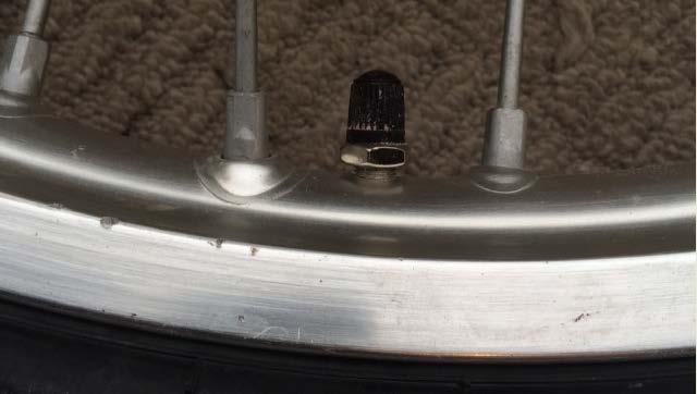 A final point, if your inner tube has a cup washer and nut on the valve stem, do not remove the bottom washer and nut.