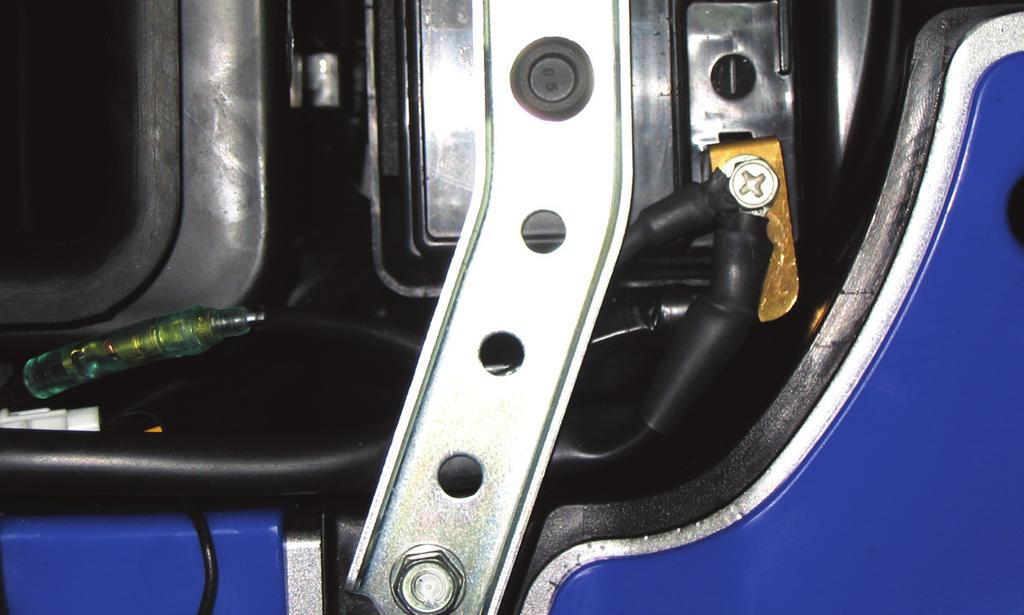 12 Mount the PCV in the pocket of the rear fender on the left side using the supplied velcro.