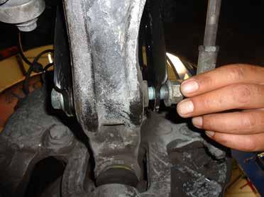 INSTALL THE COIL SPRING STRUT INTO THE VEHICLES SHOCK CAVITY.