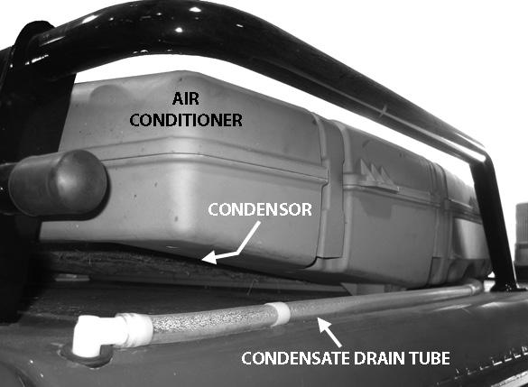 The air conditioner is located on the roof of the cab.