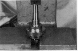 Fig. 6. Pressing out camshaft. 14. Remove the input bearing cups from the cartridges with a pulley puller, by prying or by drilling and tapping for jack screws. Fig. 7. Assembled camshaft.