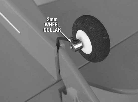 Secure it in place using a 2mm wheel collar and a 3x4mm set screw. Be sure that the tail wheel rotates freely. Oiling the tail wheel axle is recommended.
