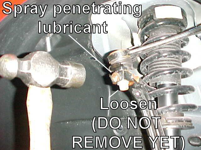 3) Loosen the upper control arm ball joint bolt (do not remove yet).