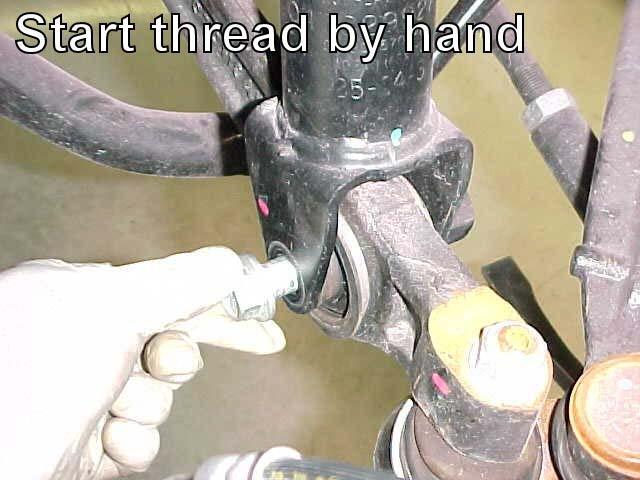 Once properly threaded fully tighten hardware.