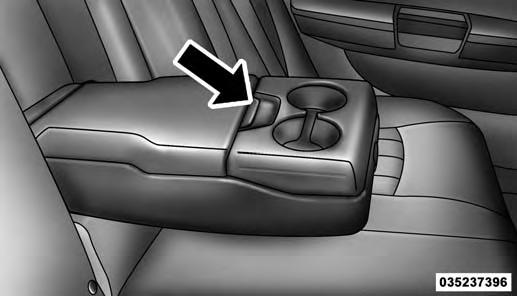 Rear Seat Armrest Storage If Equipped For rear passengers there is a storage bin located in the armrest. Lift upward on the latch to open the storage compartment.