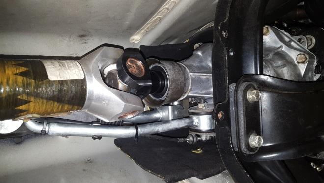 15. Re-install the drive shaft, refill the transmission fluid, and re-install down pipe bracket and down