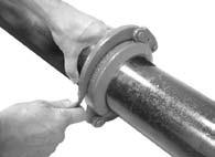 APPLY HOUSING: Open the hinged coupling and mount it around the gasket so that the