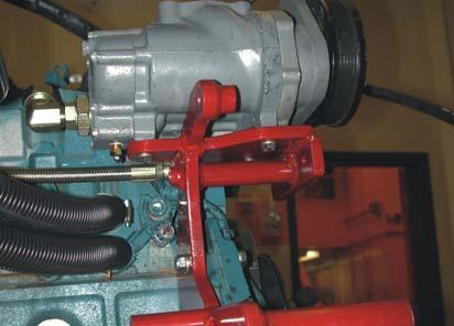 Connect the other end of this line to the 1/2 inch fitting on the right side of the compressor (Figure 3.13). 2.
