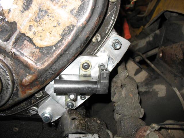 Use a proper pulley puller on the damper as it may be damaged with improper removal. Don t lose the crankshaft woodruff key!! 3. Bend timing mark index back against timing chain cover.