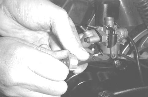 ( 12-4) Loosen the carburetor cap and remove the