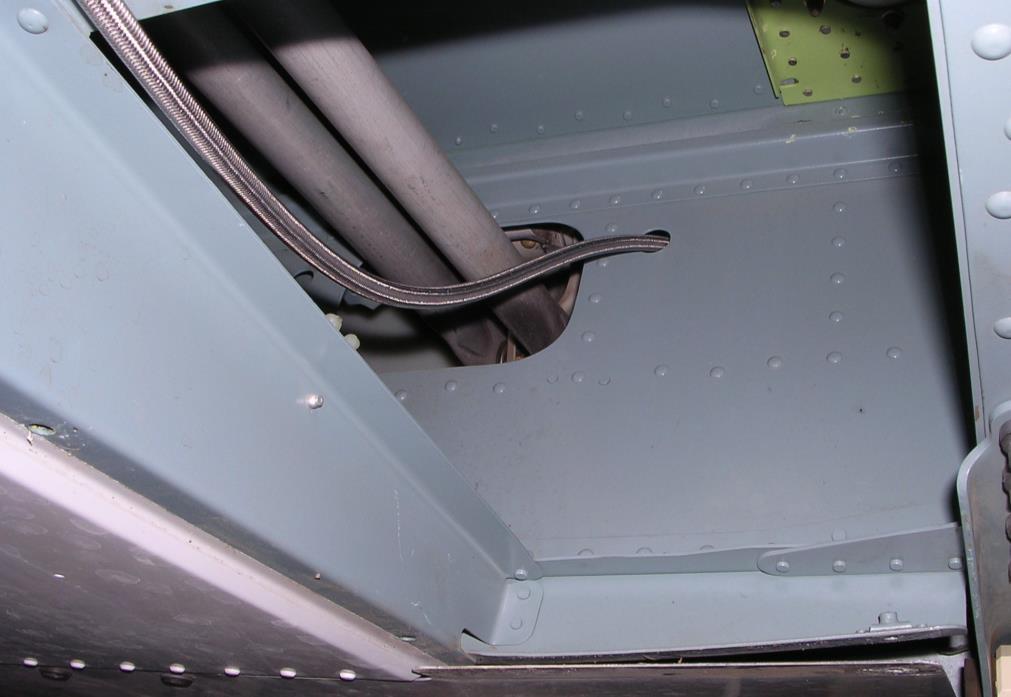 2.2 Fixed Hydraulic Release System Installation continued Route the hose up through the rear cabin bulkhead as shown in Figure 2.2.8.