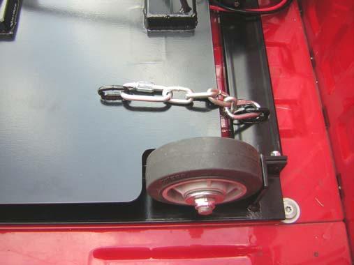 43. Insert the Safety Chains into the rings on the front right and left sides of the platform as shown above. WARNING ALWAYS INSTALL THE SAFETY CHAINS.