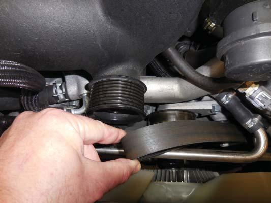 4. Remove the belt at the supercharger pulley.