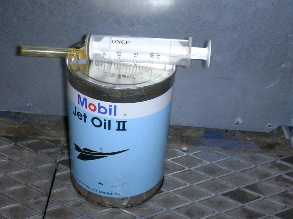 Figure 16: Syringe with oil container Draining procedure Note: Since the above tools were not available, the draining procedure followed compensated for this.