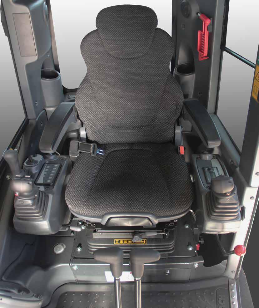 The ergonomic driver seat includes servo assisted controls, cushioned seat with arm rests and motion levers with closing pedals.