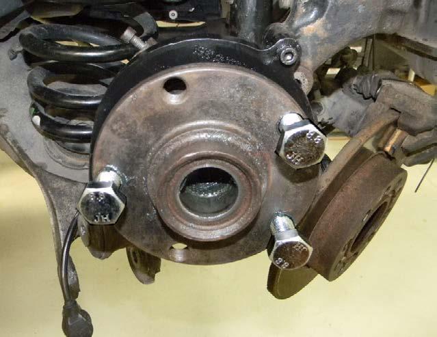 Using the brake rotor shield threaded holes, bolt the press plate onto