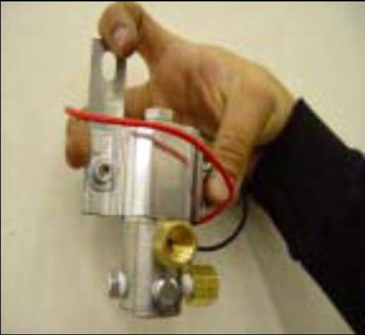 TOOLS: 7/16 Wrench, 7/16 Socket, Ratchet 3. Tighten the provided adapters and plugs to solenoid as shown.