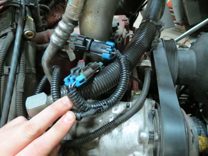 The EMP CAN adapter harness is located under the dash panels on most trucks. See Figure 2.