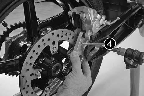 MAINTENANCE WORK ON CHASSIS AND ENGINE» 48 Dismounting and mounting the rear wheel Special stands are required to dismount the wheels to make sure the motorcycle is securely fixed.