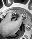 9. After mounting the spare, put the wheel nuts back on with the rounded end of the nuts toward the wheel. 10. Tighten each wheel nut by hand.