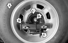 Storing a Flat or Spare Tire and Tools Inside-Mounted Tire Use the art and text following to help you store the spare or flat tire back into its proper spot when