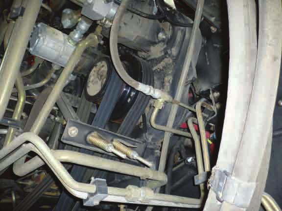 belt tensioners () on the main drive belts -