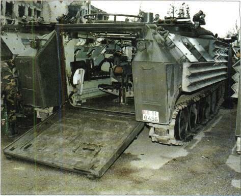 TRACKED APCs /WEAPONS CARRIERS Left: IAFV without armament and fitted with applique armour (Richard Stickland) Right: IAFV from rear with all hatches open and fitted with applique armour (Richard