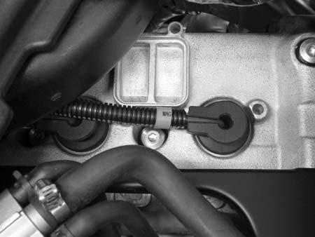 Be sure they are clean and tight. WARNING A hot engine can cause serious burns. Allow engine to cool or wear protective gloves when removing the spark plugs. 2. Remove both spark plug caps.