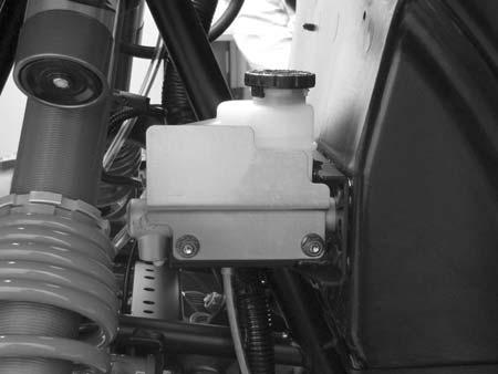 BRAKE SYSTEM Brake Fluid Inspection Always check the brake pedal travel and inspect the brake fluid reservoir level before each operation. If the fluid level is low, add DOT 4 brake fluid only.