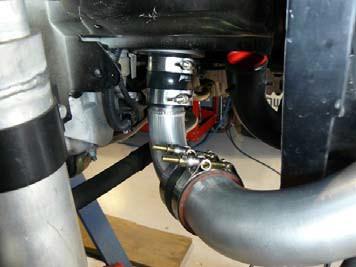 Figure 4 Step 4 On the passenger side attach the core inlet pipe to the core using an enclosed 2.5 silicone coupler and two 2.875 T-bolt clamps.