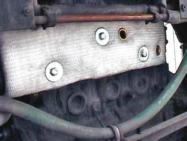 3) Install exhaust manifold insulation blanket using three new M8 x 1.