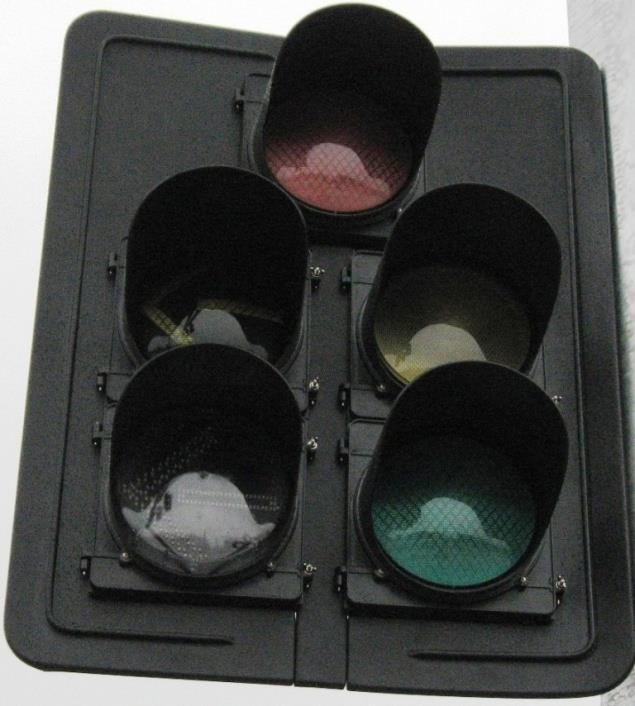 In some FYA applications where the lane is stripped for both a thru movement and a left turn, a cluster mount (dog house) style signal head configuration is used.