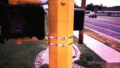 A support pipe, with an ornamental pole clamp, must be installed on the top of the pole.
