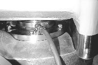 Remove the twelve (12) 5/16 seal seat retaining bolts from the back side of the pump body. 4. Loosen, but do not remove, the four (4) 3/4 body mounting plate retaining bolts. 5. Position the hoist over the fluid head and secure it to the pump body and apply lifting tension to the body.