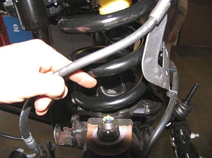 Remove the coil spring and lower seat as an assembly. Repeat for other side. Illustration1 3. Disconnect the sway bar end links from the sway bar. See illustration 2.