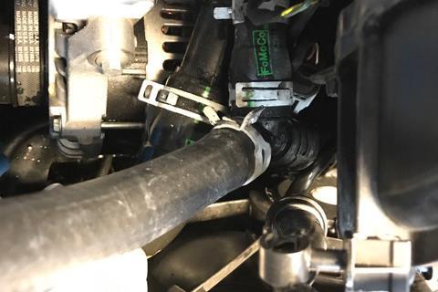 Ford Focus RS Only: 17a Locate the large diameter coolant hose that was connected to the coolant tank.