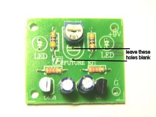 STEP 5 for Model Railroad flashers with remotely mounted leds - insert color coded wires (not included) into the holes on the