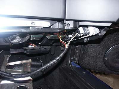 d) Plug supplied harness connectors into PCM and install the controller into the pocket under the dash