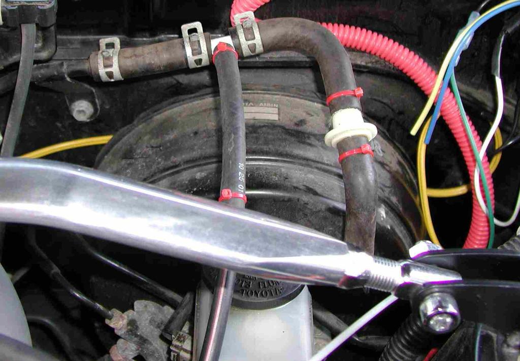 A good place to connect a vacuum/boost gauge is the brake booster vacuum line. Using a ¼ vacuum tee, the brake booster can be cut into and provide a source of manifold vacuum & pressure.
