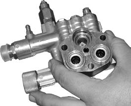 Pull out the valve cage/head ring assembly,
