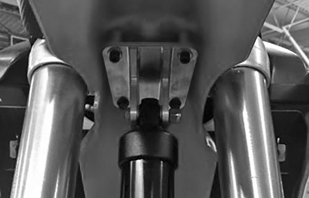 Place the lower eyelet of the TRIO shock into the original rear spindle block spacer location. The Timbersled TRIO shock is designed to have around ¼" of pre-load when installed.