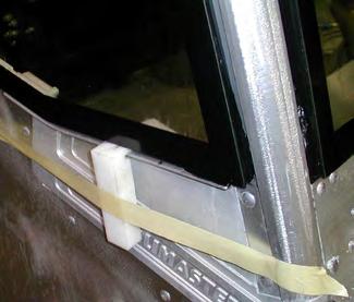 4. For the quarter glass, set the spacer block onto the flange around the window mount and tape to secure. 5. Check replacement window for fit. 6.