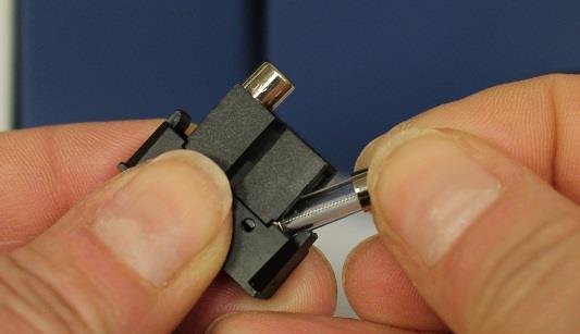 Carefully remove a fuse from the fuse holder by tilting out as shown (Fig.