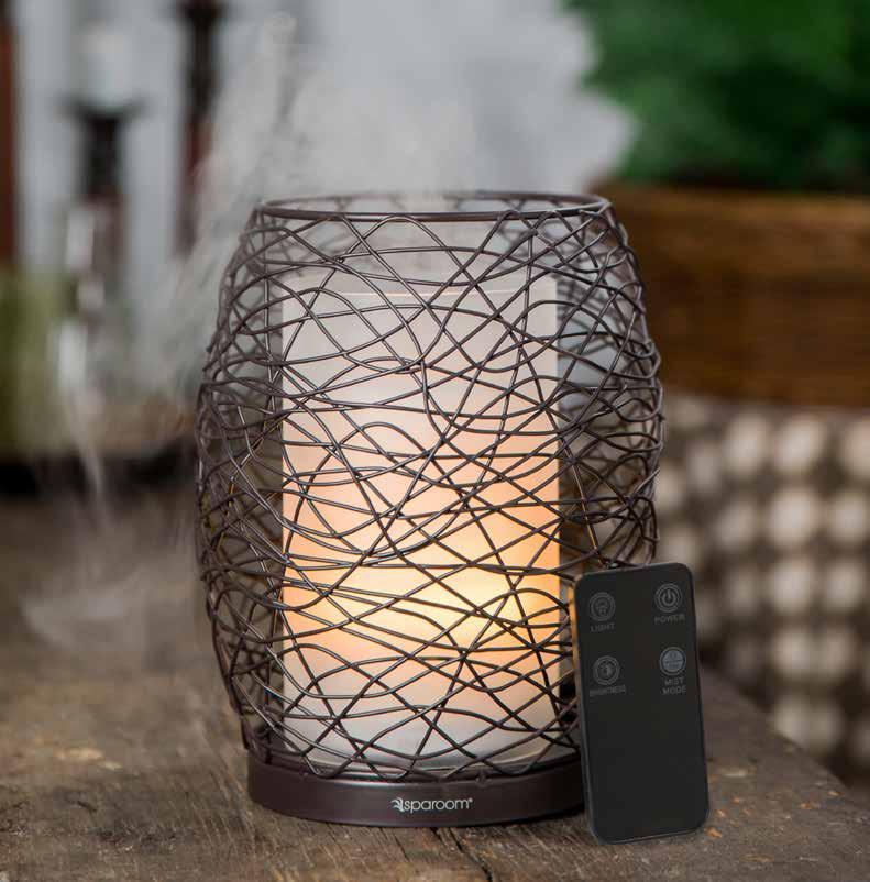 Enlighten REMOTE CONTROL ESSENTIAL OIL DIFFUSER Suggested Retail $60.00 Enlighten your atmosphere as a candlelight glow peeks through the mist as it flows through the dark chocolate framework.